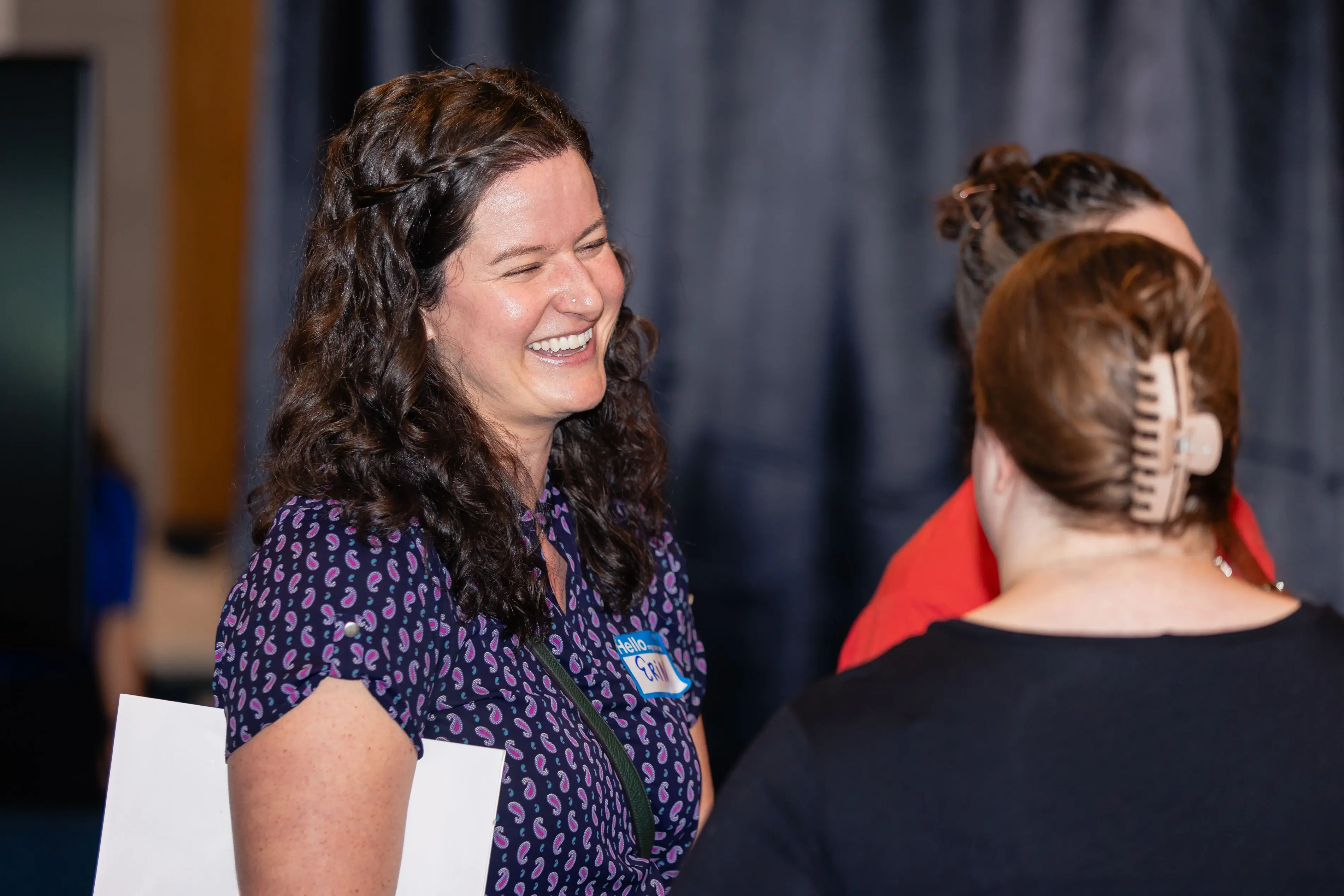 Two women networking and having friendly conversation at TechFest 2024